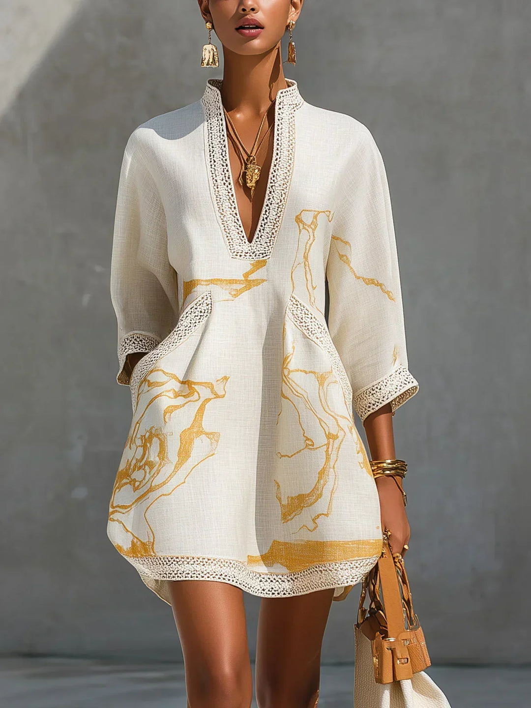 Donatella | Black minidress with golden marble print and crochet lace