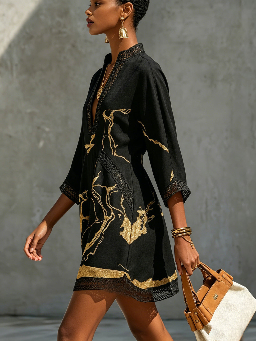 Donatella | Black minidress with golden marble print and crochet lace