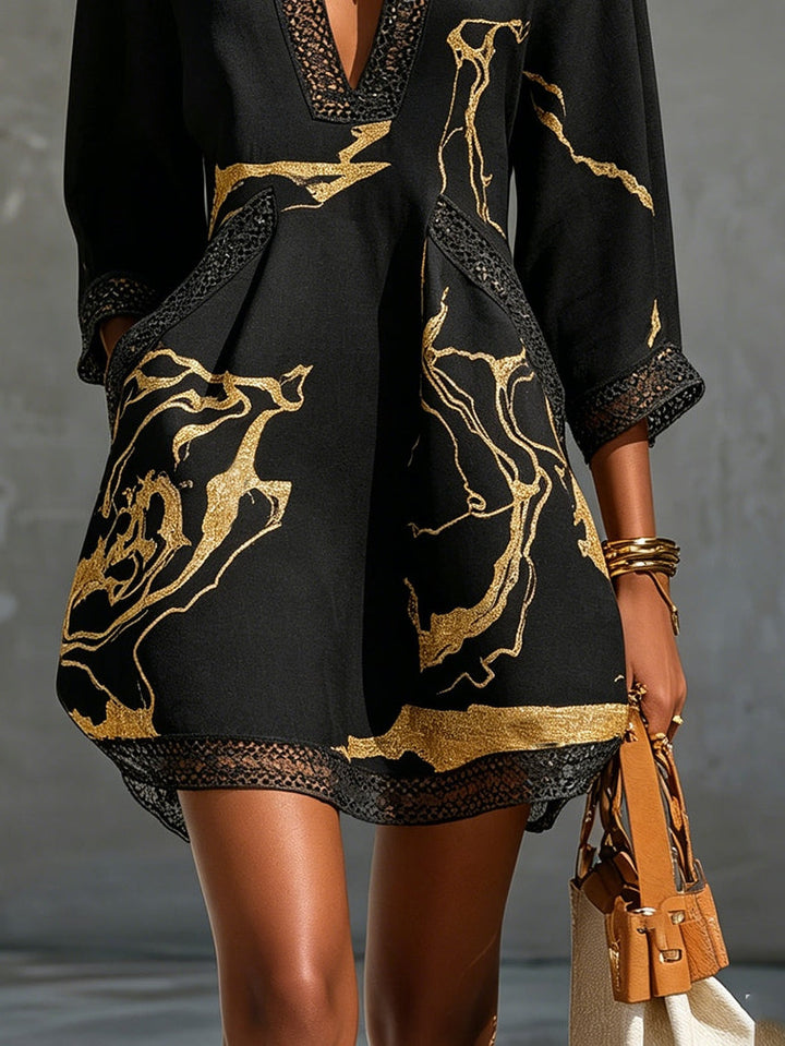 Donatella | Black minidress with golden marble print and crochet lace